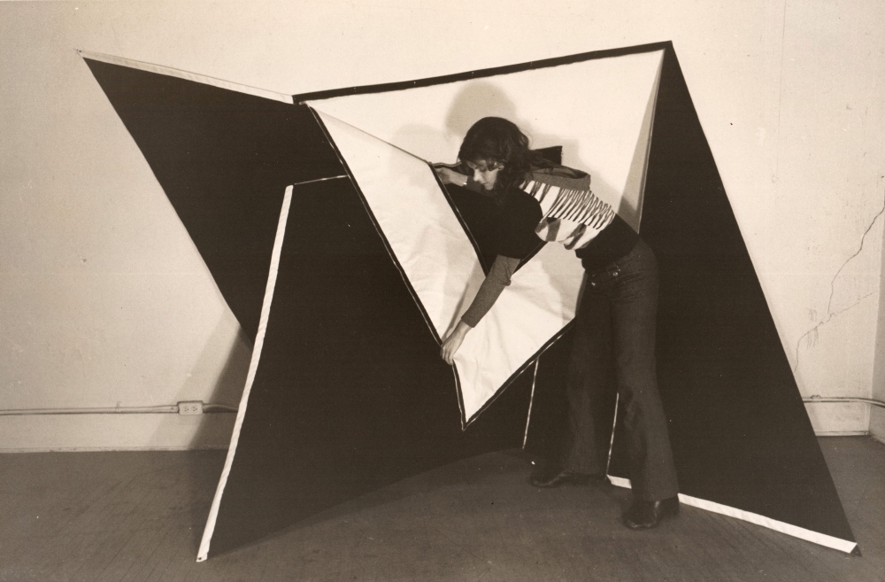 The artist with untitled Zipper work, 1972 black canvas, white duct tape, zippers 120 x 72 inches